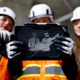 Women in construction holding construction technology innovation ipad